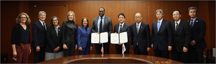 Image of CA and Japanese government staff holding the signed Letter of Intent