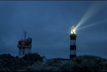 Image of a lighthouse at night