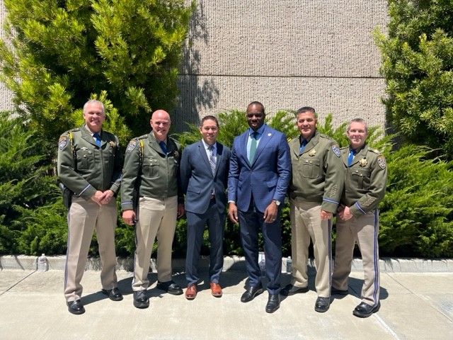 Image of Secretary Omisakin with CHP officers
