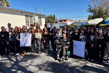 Secretary Toks with a large group of people